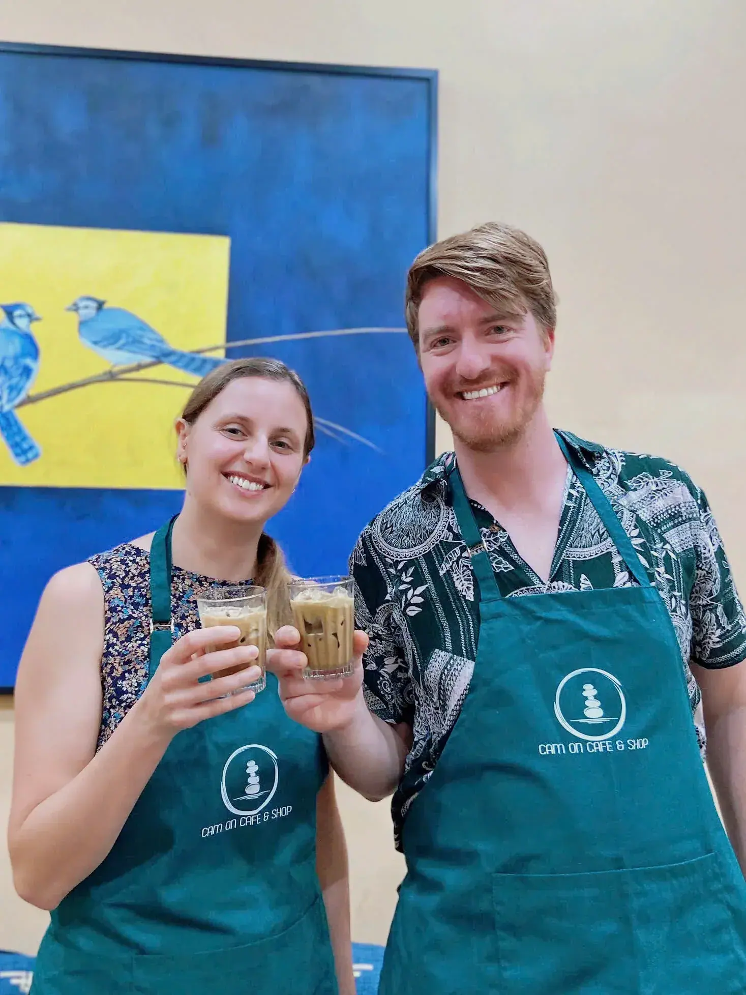A couple with the coffee they made